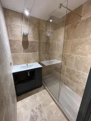a bathroom with a shower and a sink at Magnifique appartement pied dans l'eau in Cannes
