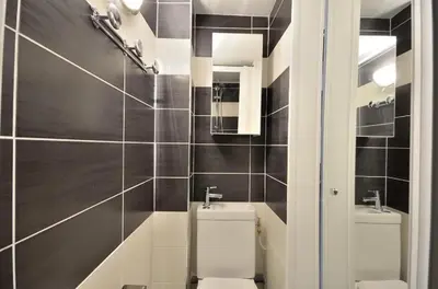 a bathroom with a toilet and a sink at SMART STUDIO in Cannes
