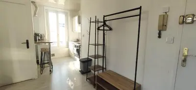 a room with a stair case in the middle of a room at APPARTEMENT CANNES MONTFLEURY in Cannes