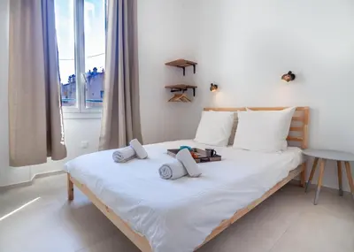 a bedroom with a bed with two pillows on it at Grand appartement 4 pièces centre de Cannes in Cannes