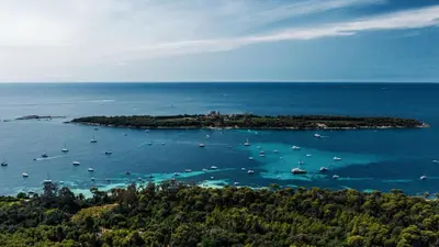 an island with boats in a large body of water at Appartement Suquet Forville in Cannes