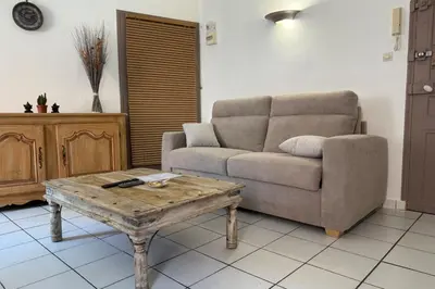 a living room with a couch and a coffee table at 1-bedroom apt 5 minutes from the Congress Center in Cannes