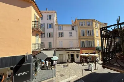 a group of buildings with people walking in a street at 1-bedroom apt 5 minutes from the Congress Center in Cannes