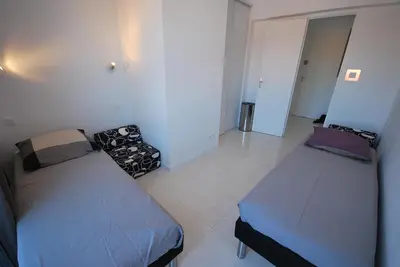 a room with two beds in a room at T3 Pte Croisette Vue mer Plage à 100m in Cannes