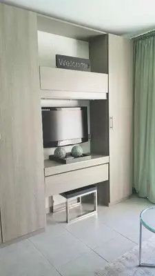 a living room with a desk with a tv at Studio Center Cannes grande Terasse in Cannes