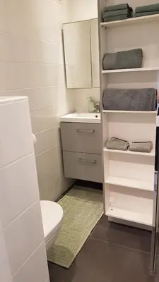 a small bathroom with a toilet and a sink at Studio Center Cannes grande Terasse in Cannes