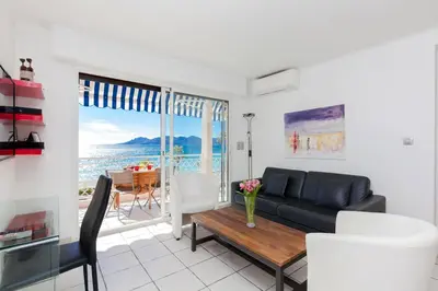 a living room with a couch and a table at Résidence Saint Rémy 2 in Cannes