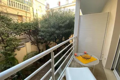 a small balcony with a table and a balcony at Renovated 2 bedrooms - Boulevard de la Croisette in Cannes