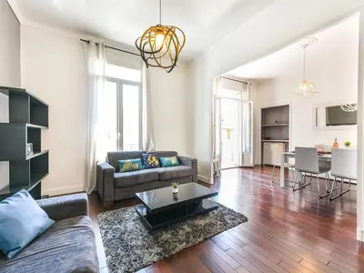 a living room with a couch and a table at Apartment Villa Chalmette by Interhome in Cannes
