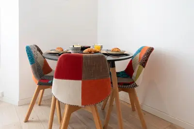 a dining room table with chairs with food on it at C11 - 1 BDR Rue Meynadier 5min Palais Festivals & Sea - AC in Cannes