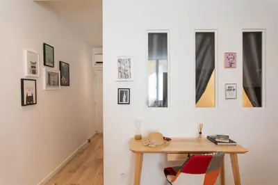 a room with a table and pictures on the wall at C11 - 1 BDR Rue Meynadier 5min Palais Festivals & Sea - AC in Cannes
