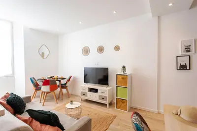 a living room with a couch and a table at C11 - 1 BDR Rue Meynadier 5min Palais Festivals & Sea - AC in Cannes