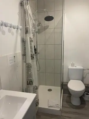 a bathroom with a shower and a toilet at Studios des Congrès et Festivals in Cannes