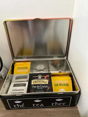 a tray with a tea kettle and glasses on a table at 2 pièces - Croisette et Plages à 10 mn à pieds in Cannes