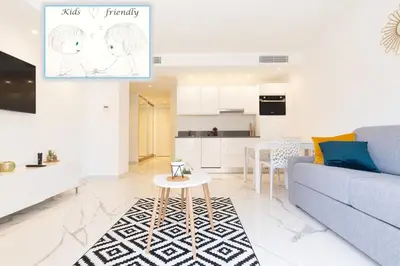a living room with a couch and a table at Brand new 2 bedrooms next to Croisette ! in Cannes