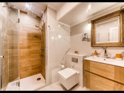 a bathroom with a shower and a toilet and a sink at Cannes Croisette Majestic Miramar in Cannes