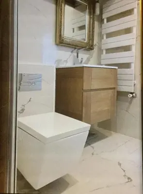 a bathroom with a white toilet and a mirror at Cannes Croisette Majestic Miramar in Cannes