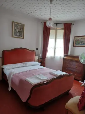 a bedroom with a large bed and a window at Appartement Cannes à quelques pas de la mer, de la Croisette et du Palais des Festivals in Cannes
