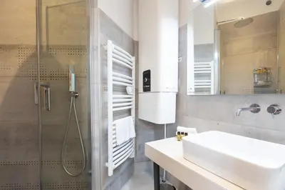 a bathroom with a sink and a shower at Astoux YourHostHelper in Cannes
