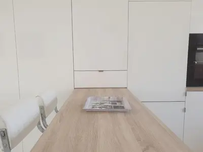 a room with a table with a magazine on it at STUDIO LES ALGUES in Cannes