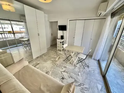 a living room with a couch and a table at Branly 3, by Welcome to Cannes in Cannes