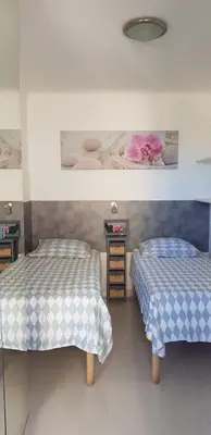 two beds in a room with two beds sidx sidx sidx sidx at Cannes Les Pins in Cannes