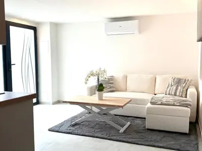 a living room with a couch and a coffee table at Appartment Jacuzzi in Cannes in Cannes