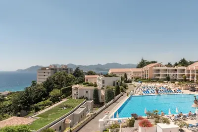 a view of a resort with a swimming pool at Résidence Cannes Villa Francia - maeva Home - Appartement 2 pièces 6 personnes avec vue mer - Sélection - super Home MAE-3641 in Cannes