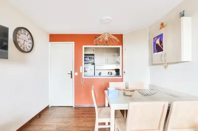 a kitchen and dining room with a table and chairs at Résidence Cannes Villa Francia - maeva Home - Appartement 2 pièces 6 personnes avec vue mer - Sélection - super Home MAE-3641 in Cannes