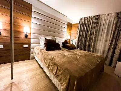 a bedroom with a bed with two pillows on it at RenTcik in Cannes