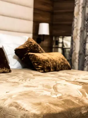 a bed with two pillows on top of it at RenTcik in Cannes