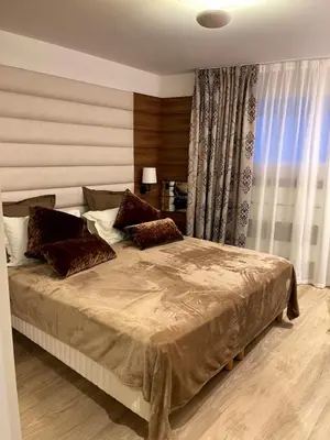 a bedroom with a large bed with pillows on it at RenTcik in Cannes