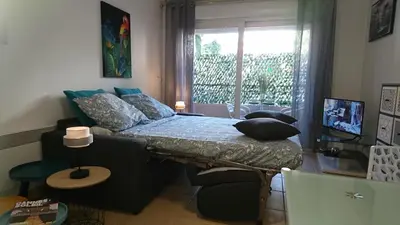 a bedroom with a bed with pillows and a window at Nicolas 2 in Cannes