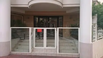 an entrance to a building with glass doors at Nicolas 2 in Cannes