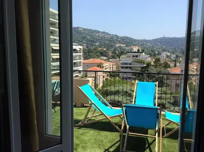 two chairs sitting on a balcony with a view at ROOFTOP#PLAGES#APERCU MER#CLIM#Festival in Cannes