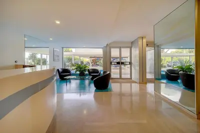 a living room with couches and a table at IMMOGROOM- Magnificent View - NEW - Terrace - AC in Cannes