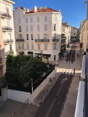 an empty street in a city with a building at Brand new studio in the heart of Cannes in Cannes