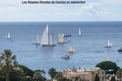 a group of sailboats in the water near a city at Sea views and beautiful pool in Cannes