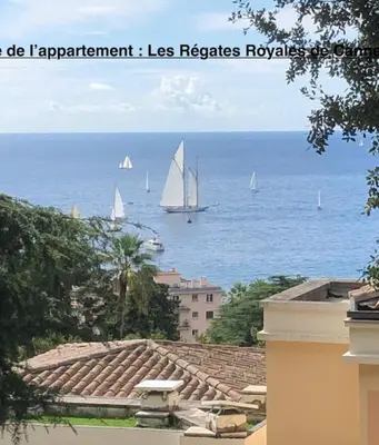 a view of the ocean with sailboats in the water at Sea views and beautiful pool in Cannes