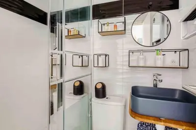 a kitchen with a counter with stools and a counter top at T2 proximité MIPIM in Cannes