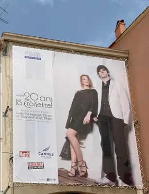 a billboard with two women standing on it at T2 proximité MIPIM in Cannes