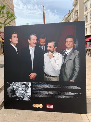 a poster for a movie with a group of men at T2 proximité MIPIM in Cannes