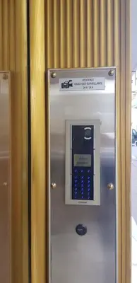 a ticket machine in a building with a sign on it at Superbe 2 pièces au calme absolu in Cannes