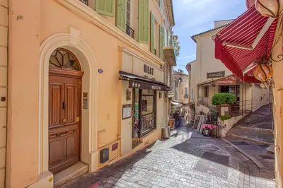 an alley in a city with buildings at Style in Cannes-Beautiful Apt-5 mins stroll to Festival-Beach-Port in Cannes