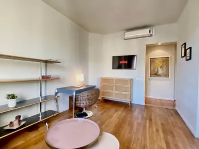 a living room with a desk and a chair at Latour Maubourg By SCLS Locations in Cannes