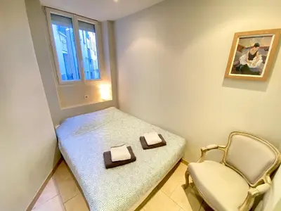 a small room with a bench and a chair at Latour Maubourg By SCLS Locations in Cannes