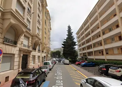 a street with cars parked on the side of a building at Latour Maubourg By SCLS Locations in Cannes