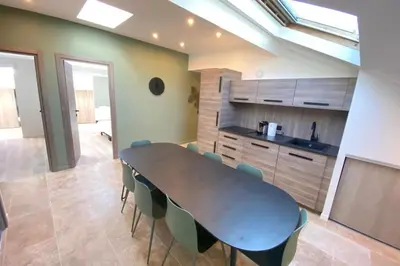 a dining room table and chairs in a kitchen at Brand new 4 bedrooms 4 bathrooms Heart of Cannes in Cannes