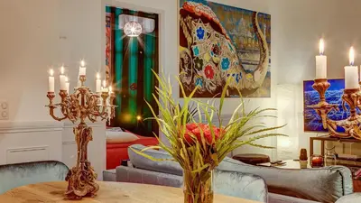 a dining room with a table and a living room at Cocoon in Cannes ***** in Cannes