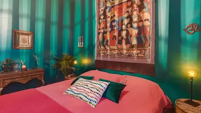 a bedroom with a bed and a painting on the wall at Cocoon in Cannes ***** in Cannes